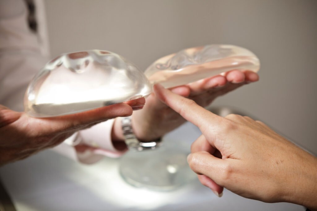 Woman selecting breast implants during a consultation