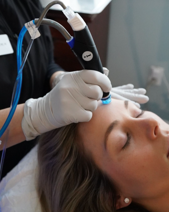 Close up of woman getting a Hydrafacial treatment at Boston Plastic Surgery's Skin Wellness Center