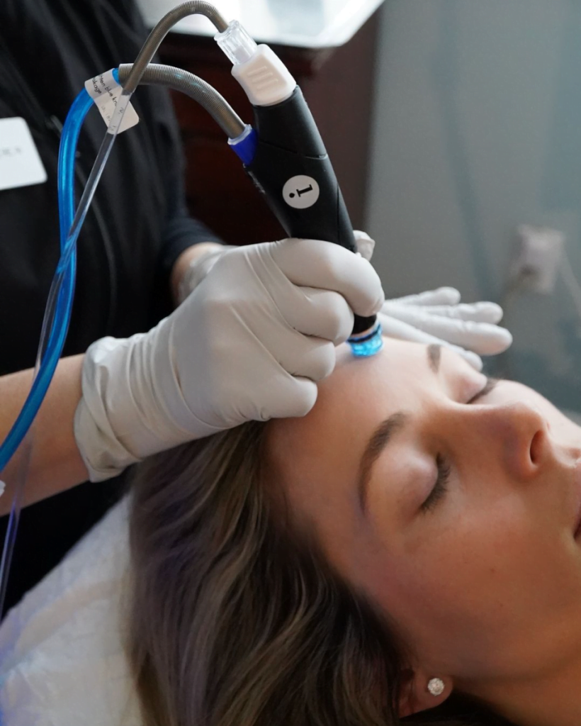 Close up of woman getting a Hydrafacial treatment at Boston Plastic Surgery's Skin Wellness Center