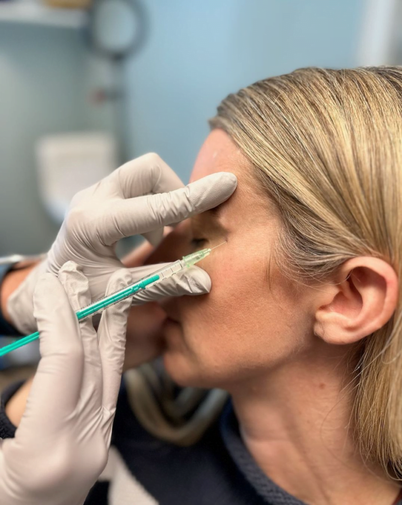 Woman getting injectable treatment for crow's feet at Boston Plastic Surgery