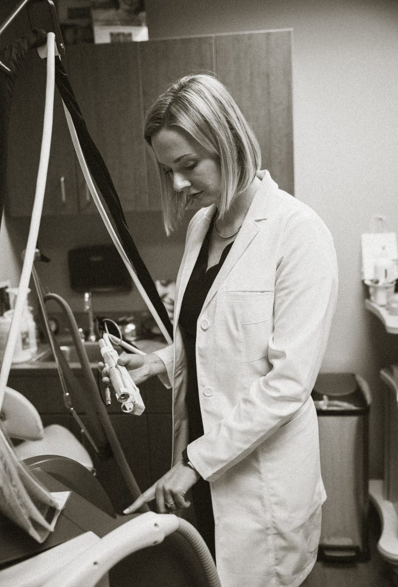 Boston plastic surgeon Dr. Allanah Phelan prepares a non-surgical treatment room for a procedure