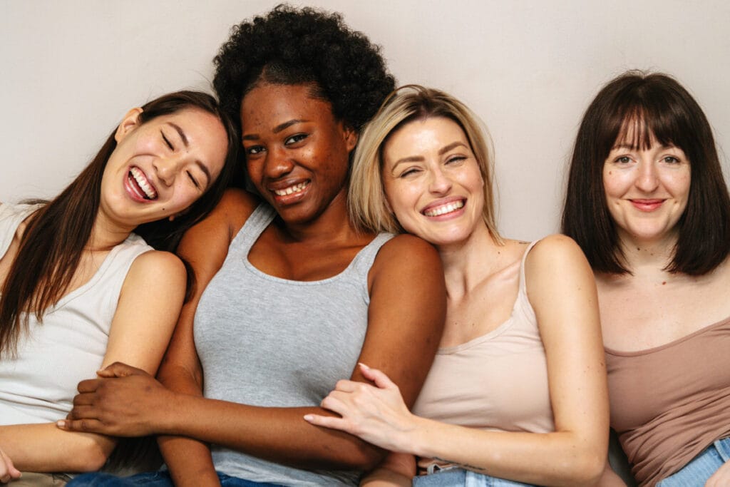 Group of smiling, diverse women